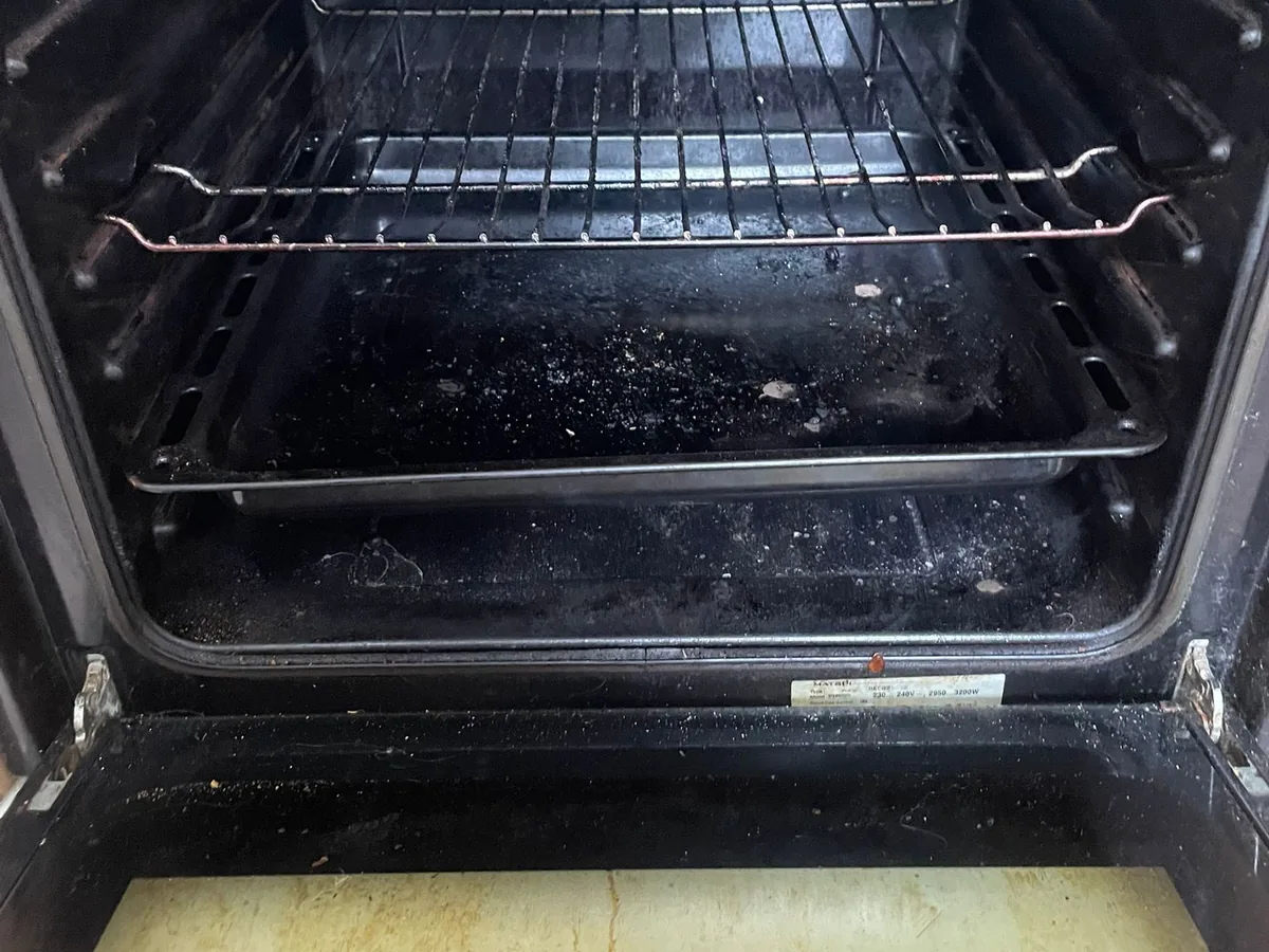 Grimy oven interior before cleaning